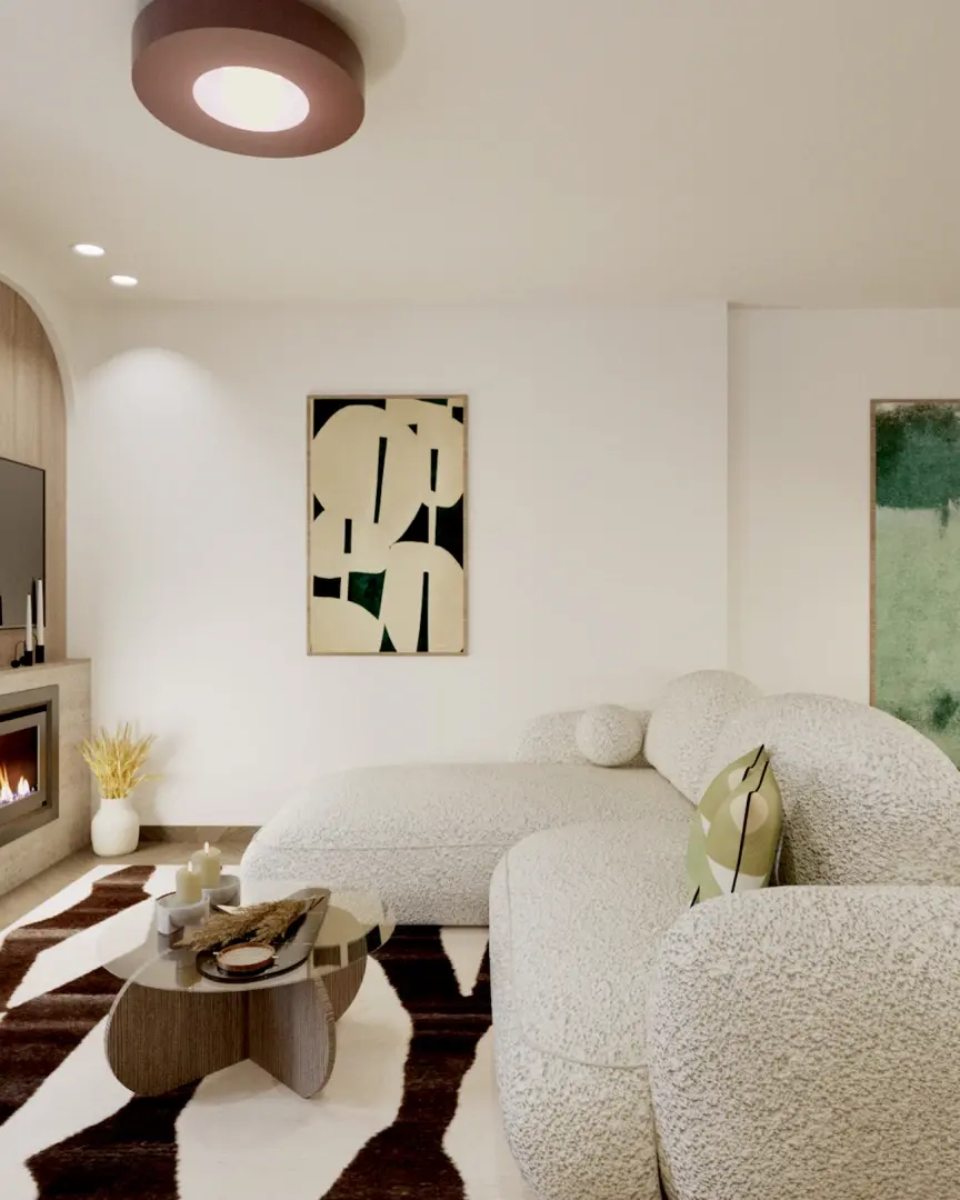 Lounge—center pendant & spots: Circular ceiling pendant and discreet recessed spots softly illuminate boucle seating and artwork for a cozy living room feel.