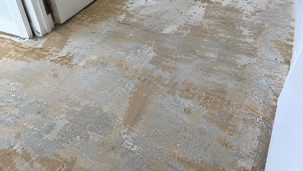 Adhesive residue on subfloor after glue-down hardwood floor removal