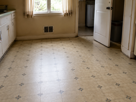 Older Oregon home flooring being assessed for asbestos before remodel demo