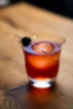 A La Louisiane cocktail, served with a cocktail cherry in a pick
