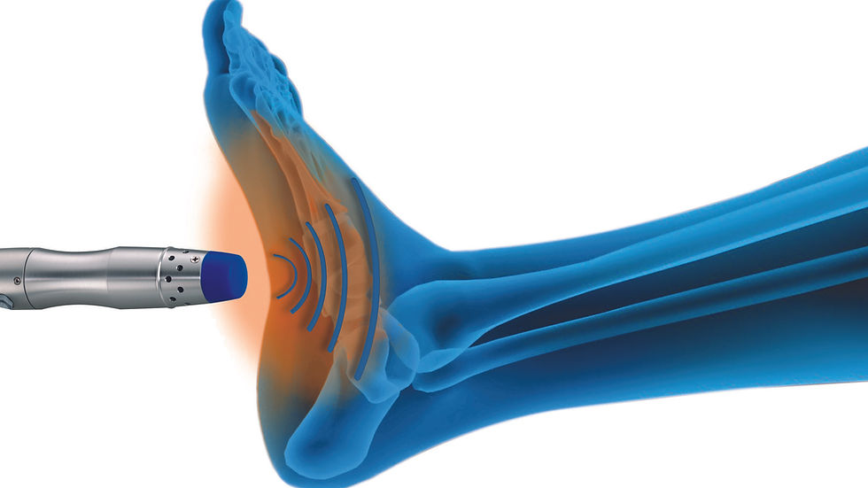 Close-up view of a handheld therapy applicator placed near the heel.
