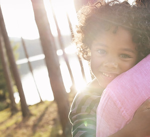 Child hugging parent