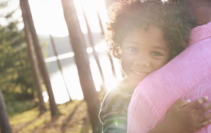 Child hugging parent
