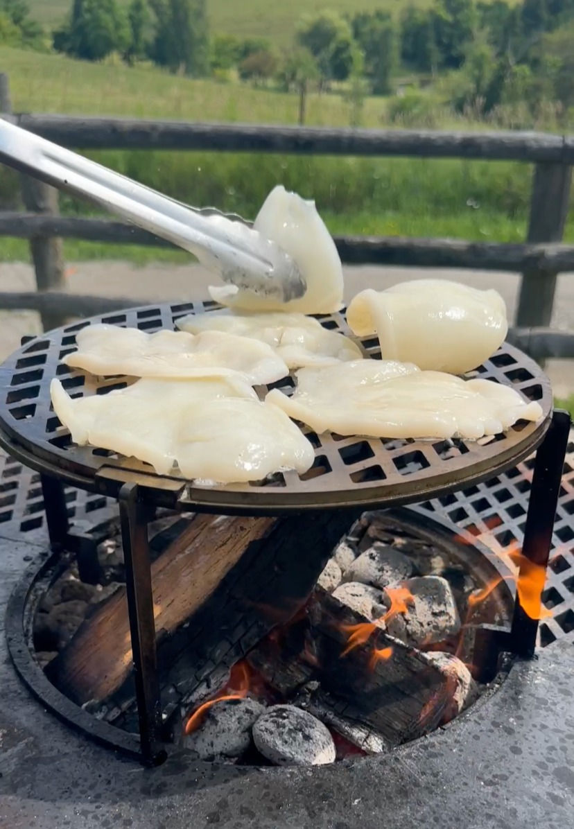 calamari being grilled on the Alchemy elevated grill rack