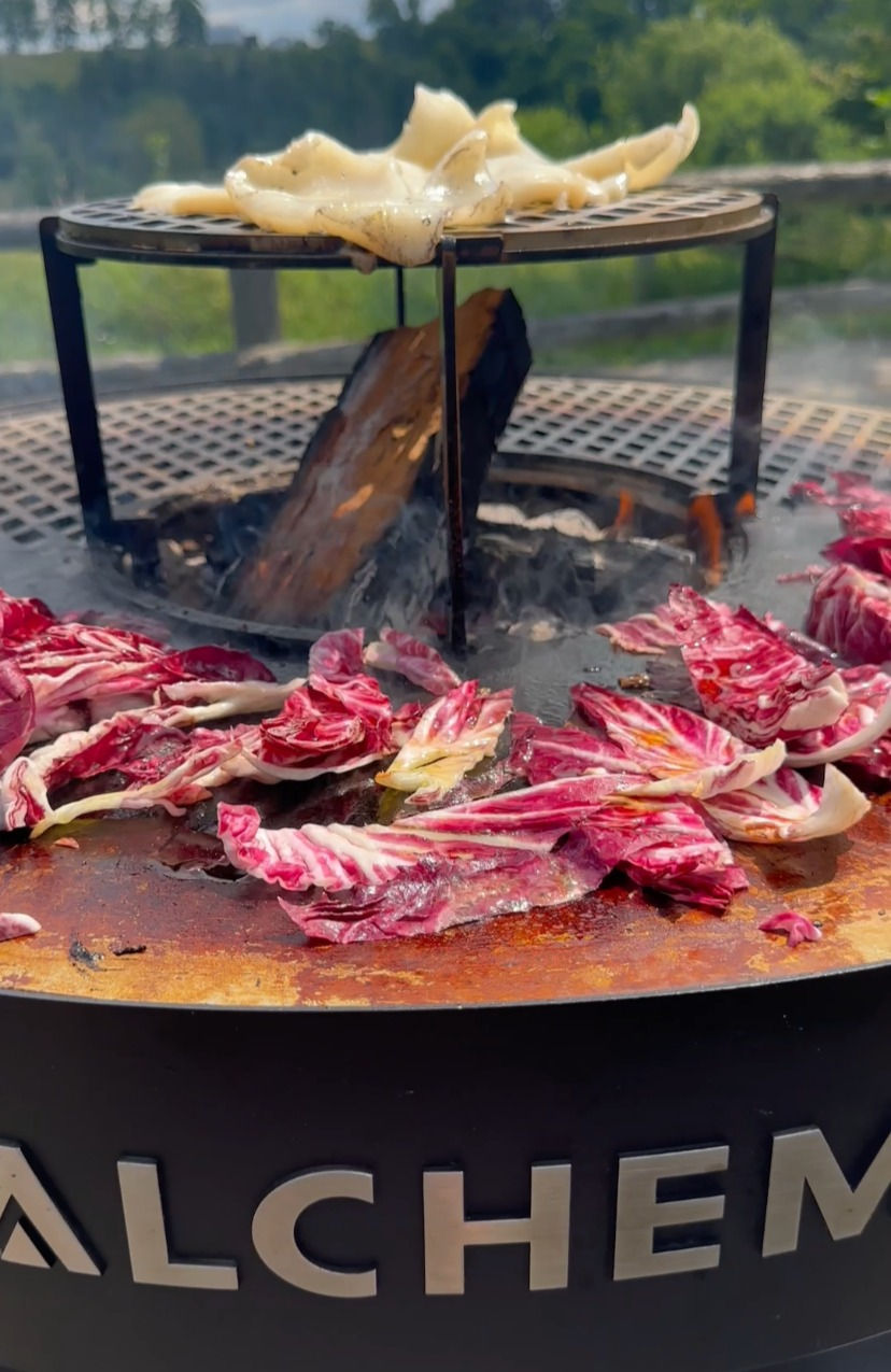 radicchio grilling on the plancha with the calamari grilling on the elevated grill rack