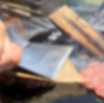 smash burgers being pressed on the grill