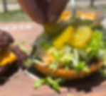 lettuce and pickles on a hamburger bun