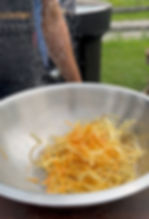 salting the matchstick fries in a bowl