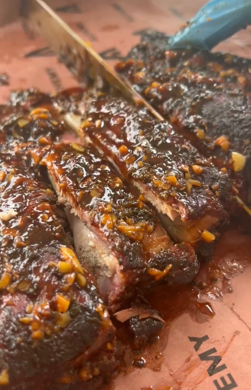 smoked side ribs with gochuchang sauce being cut up