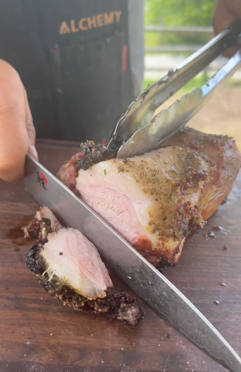 smoked and seared pork loin being sliced