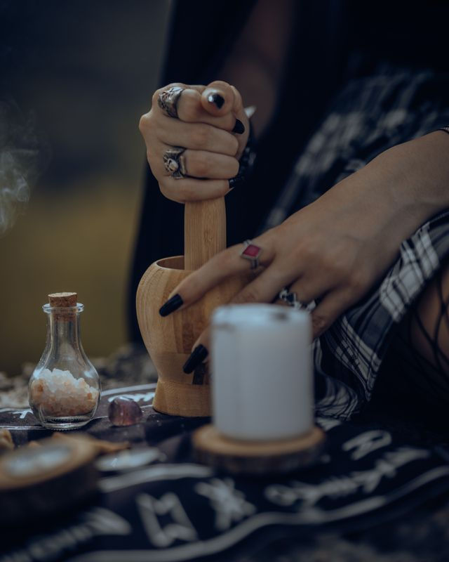 Woman preparing a concoction in a mortar