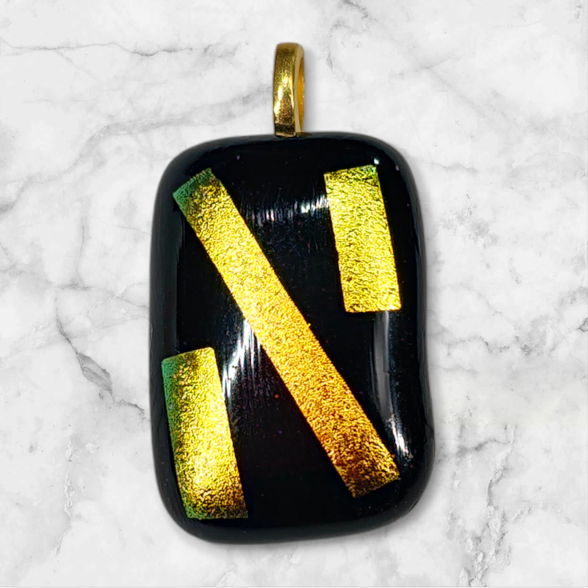 gold and black pendant only