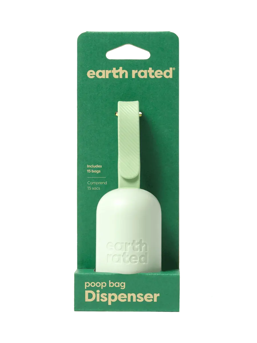 Earth Rated Poop Bag Dispenser attached to a leash, showcasing its compact design, preloaded bags, and convenient hook