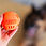 Thumbnail: A bright and durable Totally Pooched Stuff n' Brush Ball designed for interactive play, dental health, and treat-stuffing fun