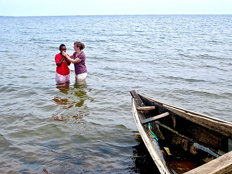 Sandie Kilian of Mercy Partners baptizing, baptism, in Uganda