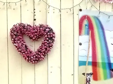 Part of a dog memory garden, with Scotty's Cartoons print and a flower heart