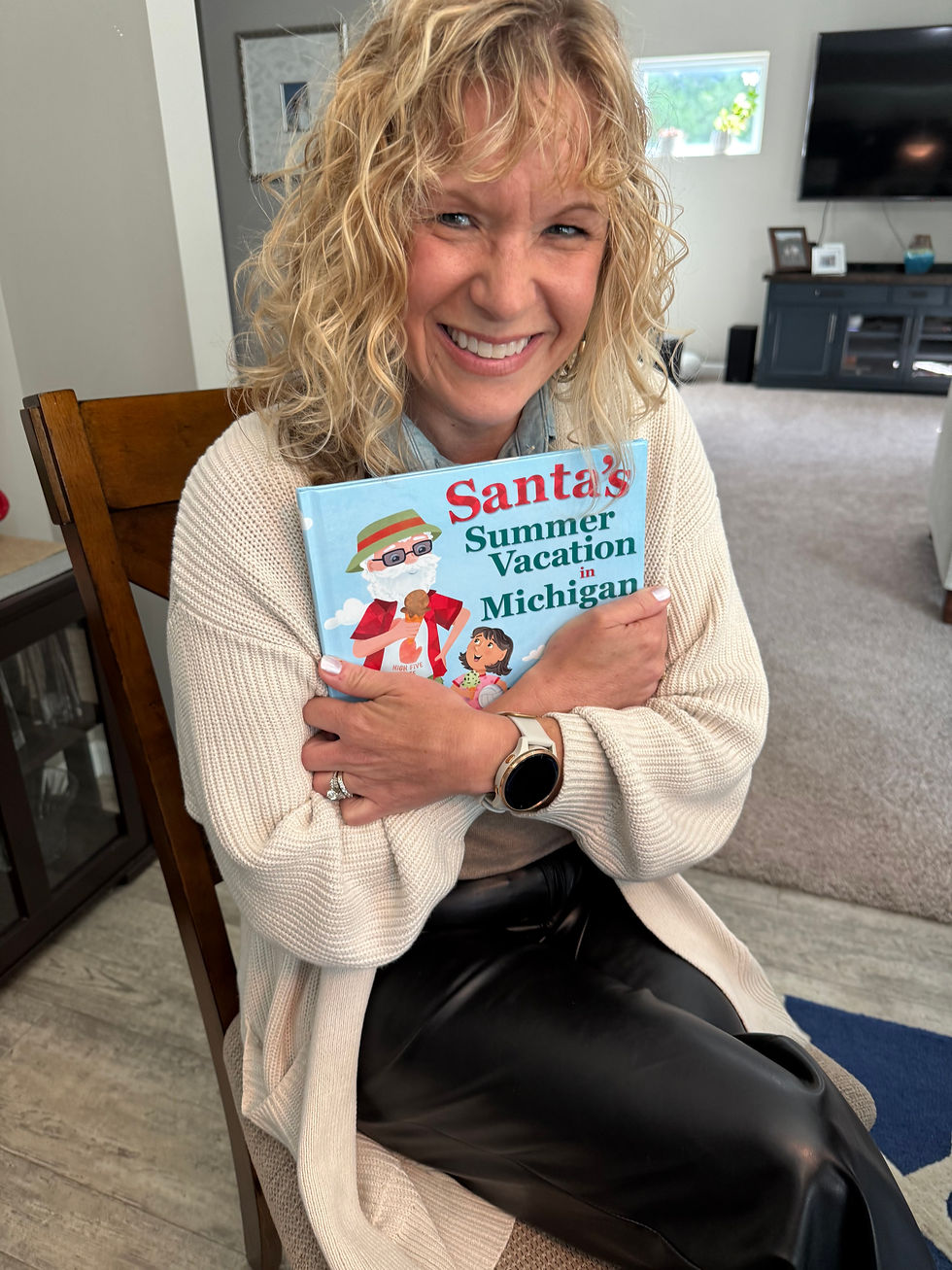 I'm hugging my book for reporter Elizabeth Granger to snap a photo for her article.