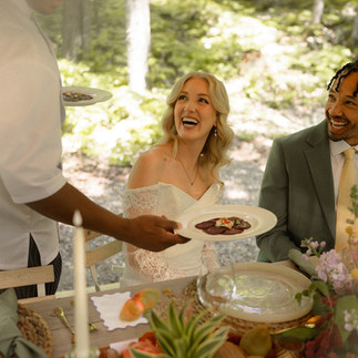 Wedding reception and food being served to the couple