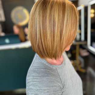 Soft ginger red hair color with natural warm tones at The Studio Salon in Stuart, Florida