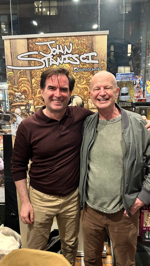 comic illustrator John Stanisci stands next to his older mentor Klaus Janson