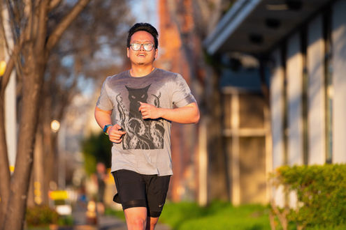CrossFit Oakland member, asian-american male, gray t-shirt, running outside