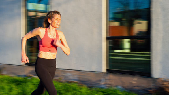Blonde Crossfit Oakland Member runs outside as part of her lifestyle coaching program