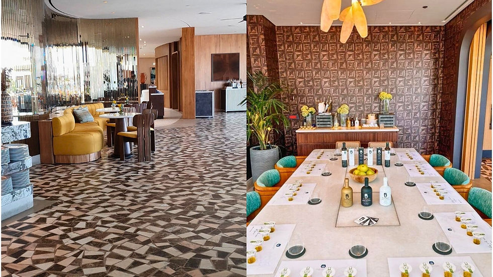 White marble tasting table at Ora, set with PJ Kabos olive oil bottles in white, black, and gold. at One&Only Aesthesis glamorous resort, Athens, Greece (Glyfada). or Marble table set with PJ Kabos olive oil bottles in white, black, and gold at Ora restaurant.