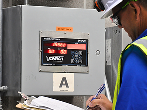 A service man looking at a prcoessor