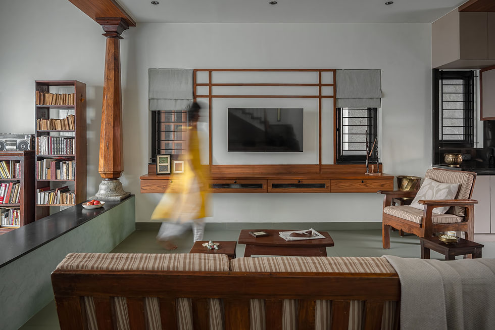 warm living room with reused furniture and traditional verandah-inspired seating