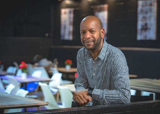 Jesse Patterson poses in his restaurant, Southern Hospitality