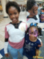 Kids enjoying airbrushed butterfly masks