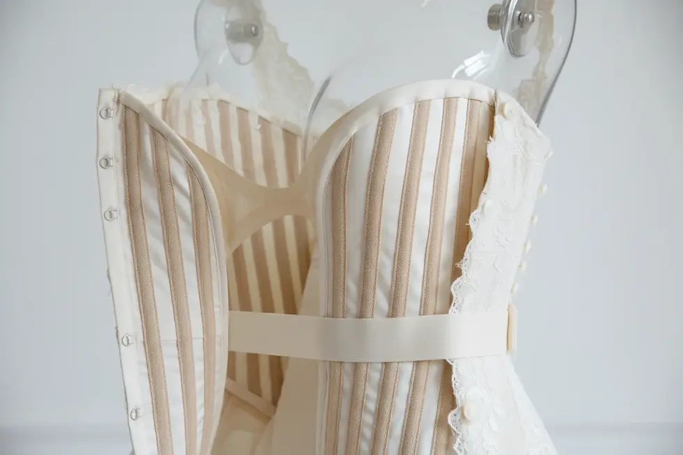 Internal bridal garment construction standards featuring reinforced boning channels and waist stay