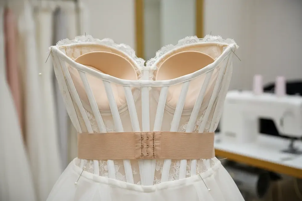 Internal corset boning and structural support aligned with wedding dress sizing standards