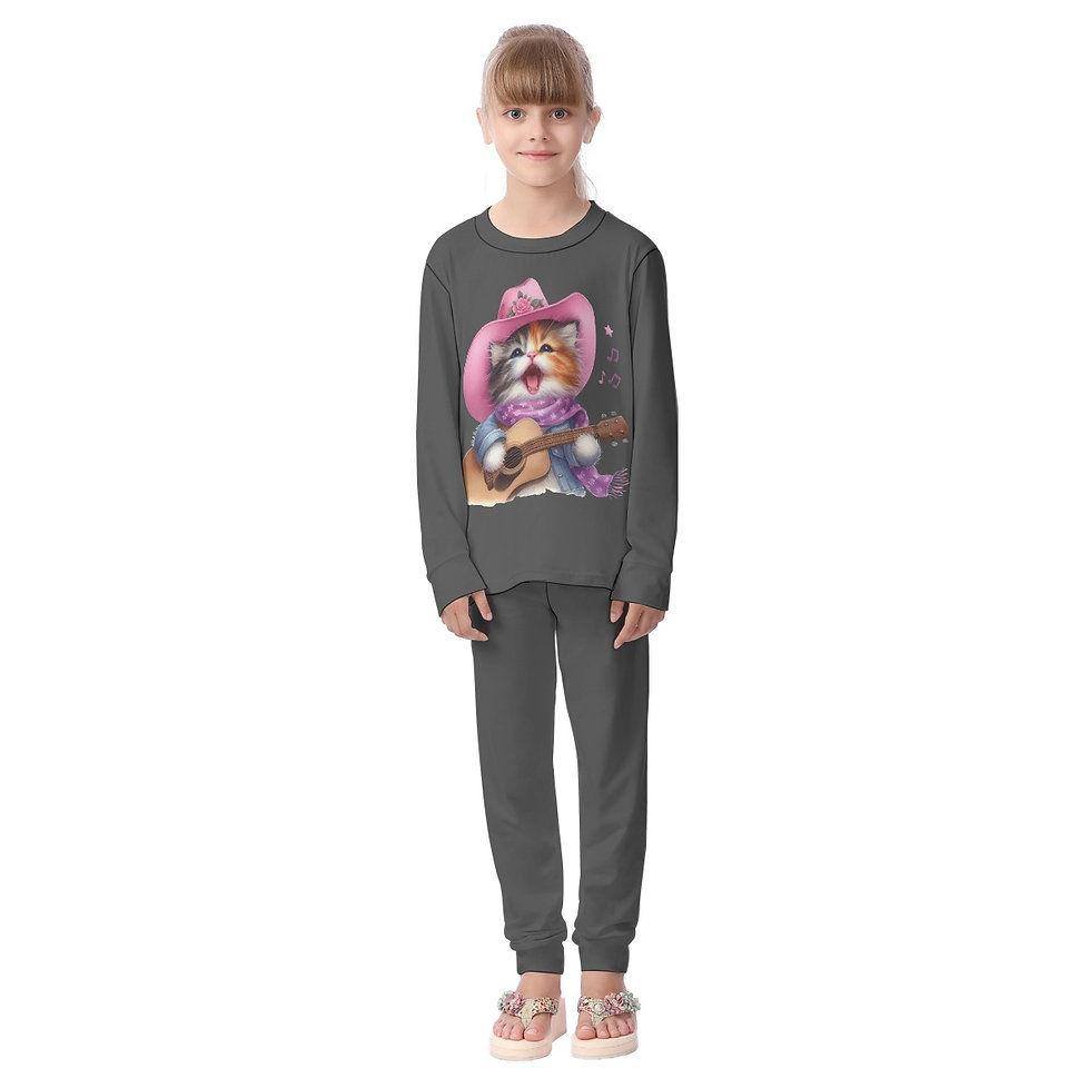 Young girl in her grey cat-themed pajamas