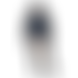 Person wearing a navy blue hoodie with a graphic on the left chest, paired with beige pants, standing against a plain background