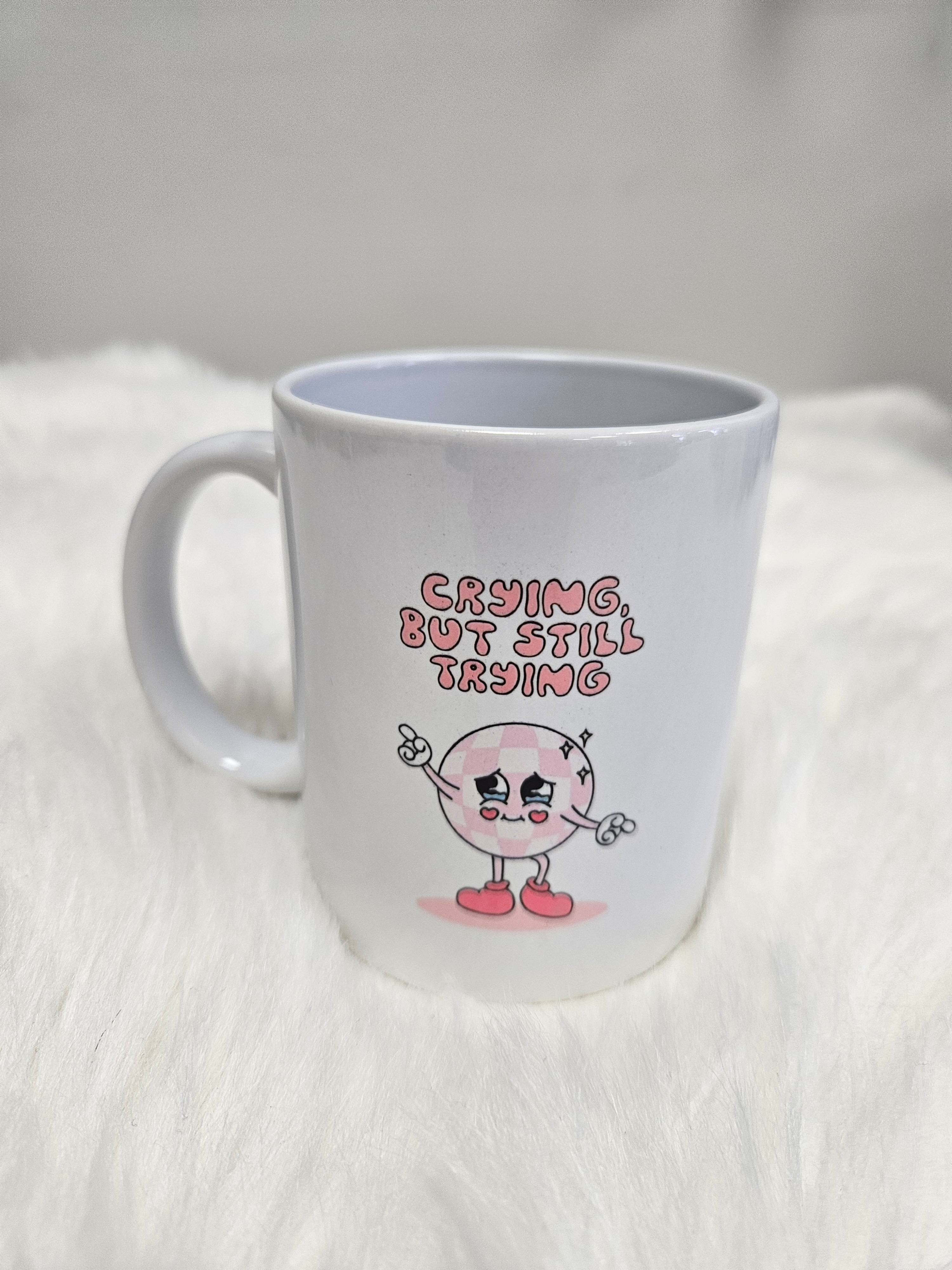 330 ml mug featuring the design "Crying but still trying"