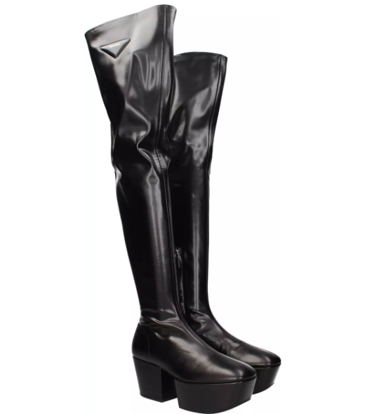 Black patent leather Prada over-the-knee boots with platform sole and block heel.