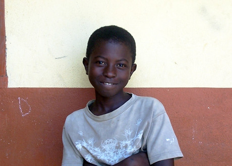 Smart boy smiling at school