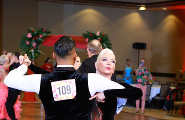 Student Billie and instructor Jordan performing a tango at the Phoenix fall dance competition, showcasing the tango dance lessons available in Tempe.