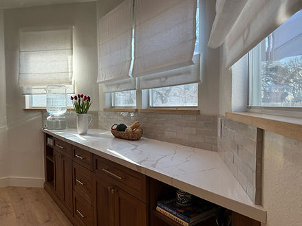 Modern, open-concept kitchen renovation with sleek countertops and custom cabinetry