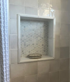 Luxurious bathroom remodel featuring a spa-style shower and elegant fixtures
