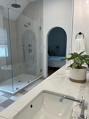 Luxurious bathroom remodel featuring a spa-style shower and elegant fixtures