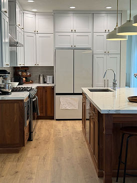 killed craftsman carefully installing a custom tile backsplash in a kitchen