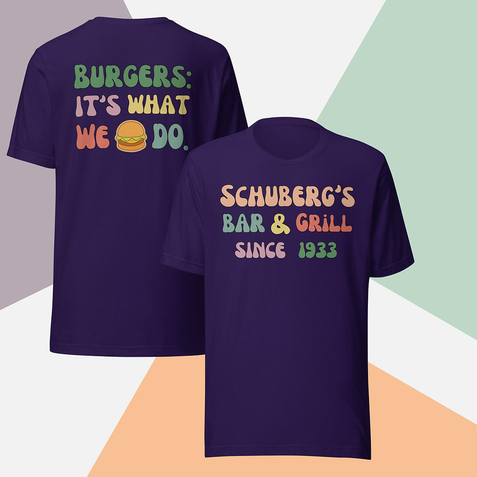 Front and back of a purple t-shirt. Front has text "Schuberg's Bar & Grill Since 1933" in various colors and wavy text. Back has text "Burger: It's What We Do." in various colors and wavy text with a burger sticker.