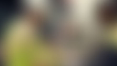 Two men on a construction site entry point completing work readiness inputs on a tablet and phone.