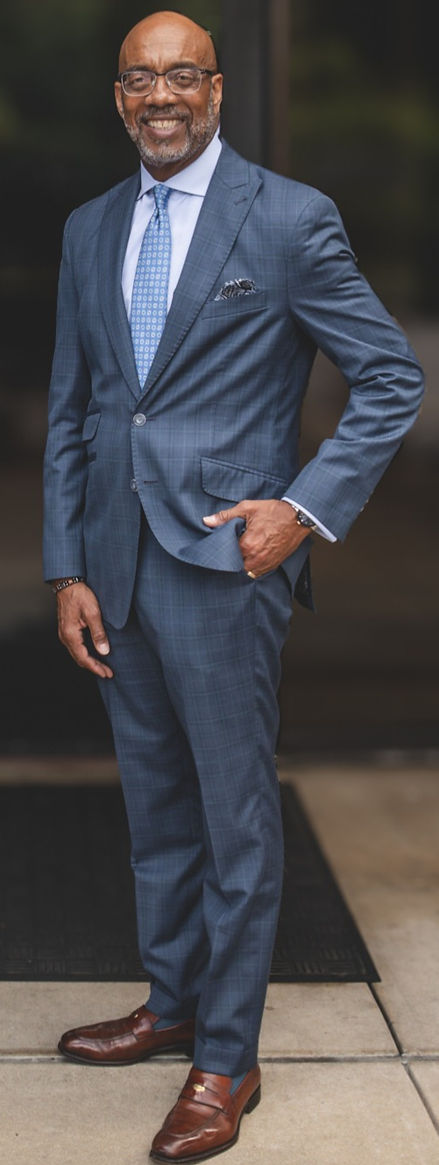 James Clayborne standing in front of building