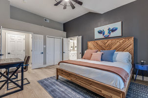 Master bedroom with a king bed designed for a short term rental.