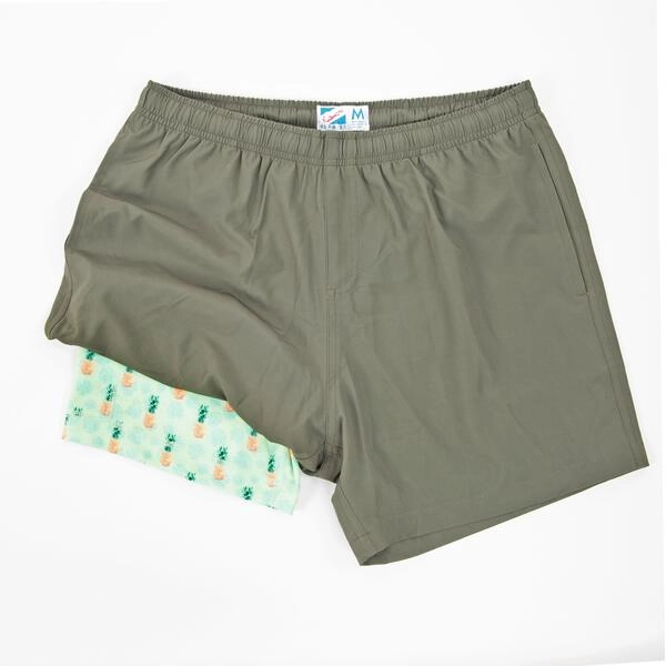 Green Sport Shorts displaying the bright green pineable liner under one leg.