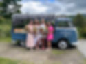 Four women holding flowers by the Ringo flower truck