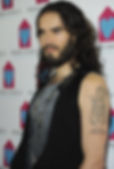 Russell Brand showing his tattoo of Sri Krishna